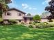Charming two-story home with landscaped front yard and brick accents, creating a welcoming curb appeal at 5730 Teresa Dr, Alexandria, IN 46001