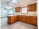 Open kitchen area featuring oak cabinets and views to the dining room at 5730 Teresa Dr, Alexandria, IN 46001