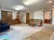 Spacious carpeted living area with a brick fireplace, comfortable sofas, and ample room for entertaining at 5730 Teresa Dr, Alexandria, IN 46001
