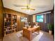 Traditional office space with wood paneling, built in shelves and a bright window at 5730 Teresa Dr, Alexandria, IN 46001