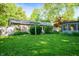 Spacious backyard with lush green lawn and a gazebo, perfect for outdoor activities and relaxation at 5873 N Victoria Dr, Indianapolis, IN 46228