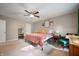 Comfortable bedroom featuring a ceiling fan, accent wall, and comfortable-looking bed and accents at 5873 N Victoria Dr, Indianapolis, IN 46228