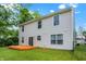 A fenced backyard with a deck and lush green lawn at 6010 Lakeside Manor Ave, Indianapolis, IN 46254