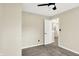 Bedroom with a ceiling fan, plush carpeting, and plenty of sunlight at 6010 Lakeside Manor Ave, Indianapolis, IN 46254