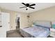 Comfortable bedroom featuring plush carpeting and an access door to a walk-in closet at 6010 Lakeside Manor Ave, Indianapolis, IN 46254