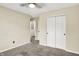 Carpeted bedroom with neutral walls and a double door closet at 6010 Lakeside Manor Ave, Indianapolis, IN 46254