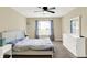 Carpeted bedroom featuring a window, closet, dresser, and ceiling fan at 6010 Lakeside Manor Ave, Indianapolis, IN 46254