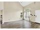 Bright living room features high ceilings, large windows that let in plenty of natural light and new vinyl floors at 6010 Lakeside Manor Ave, Indianapolis, IN 46254
