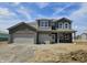 Two-story home featuring a two-car garage, brick and shingle siding, white trim, and professional design at 6032 Granby Dr, Whitestown, IN 46075