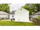 Home's backyard, with patio and furniture set, and manicured green lawn, great for families and outdoor living at 6040 Crittenden Ave, Indianapolis, IN 46220
