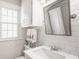Charming bathroom with classic tiling, a bright window, and fresh decor at 6040 Crittenden Ave, Indianapolis, IN 46220