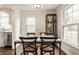 Dining room features a marble table, hardwood floors and plenty of natural light at 6040 Crittenden Ave, Indianapolis, IN 46220