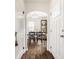 View of a dining room with hardwood floors, a marble table, and light fixture at 6040 Crittenden Ave, Indianapolis, IN 46220