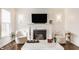 Cozy living room showcasing a fireplace, marble coffee table, and stylish decor at 6040 Crittenden Ave, Indianapolis, IN 46220