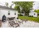 Inviting outdoor patio with ample seating, a grill, and a well-maintained yard, perfect for entertaining at 6040 Crittenden Ave, Indianapolis, IN 46220