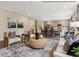 Open-concept living room, seamlessly connects with a dining area and a well-appointed kitchen at 6049 Madera Dr, Whitestown, IN 46075