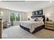 Tranquil bedroom featuring a large window, elegant décor, and plush bedding, creating a relaxing retreat at 6049 Madera Dr, Whitestown, IN 46075