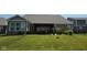Large backyard with a patio and an elegant pergola-covered dining area at 6184 Farlin Dr, Whitestown, IN 46075