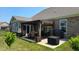 Cozy backyard patio area with a dining table, grill, and outdoor seating at 6184 Farlin Dr, Whitestown, IN 46075