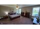 Spacious bedroom with natural light, a ceiling fan, and plenty of storage at 6184 Farlin Dr, Whitestown, IN 46075