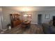 Comfortable dining room adjacent to the living room with chandelier lighting at 6184 Farlin Dr, Whitestown, IN 46075