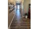 Spacious hallway adorned with photos and elegant décor at 6184 Farlin Dr, Whitestown, IN 46075