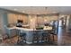 Well-lit kitchen featuring bar seating, stainless steel appliances, and ample countertop space at 6184 Farlin Dr, Whitestown, IN 46075