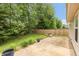 Backyard features a brick paver patio, mature trees, and landscaping at 6369 Clary Ln, Greenwood, IN 46143