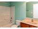 Bathroom with blue walls, a tub, a toilet, and a single sink vanity at 6369 Clary Ln, Greenwood, IN 46143
