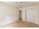 Bright bedroom features a ceiling fan, carpet floors, and closet space at 6369 Clary Ln, Greenwood, IN 46143