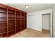 Bedroom featuring carpet, large wooden bookcase, and closet at 6369 Clary Ln, Greenwood, IN 46143
