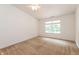 Bright bedroom with neutral carpet, a ceiling fan, and a large window at 6369 Clary Ln, Greenwood, IN 46143