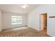 Bedroom featuring neutral carpet, a ceiling fan, and a window with exterior view at 6369 Clary Ln, Greenwood, IN 46143