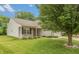 Well-maintained home with manicured lawn, mature tree, vinyl siding and brick accents adding curb appeal at 6369 Clary Ln, Greenwood, IN 46143