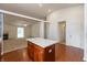 Open kitchen with island looking to living room with fireplace at 6369 Clary Ln, Greenwood, IN 46143