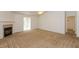 Open concept carpeted living room featuring a cozy fireplace and an abundance of natural light at 6369 Clary Ln, Greenwood, IN 46143