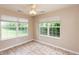 The sunroom has tile floors, a ceiling fan, and multiple windows at 6369 Clary Ln, Greenwood, IN 46143