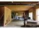 Unfinished basement with exposed wood framing, concrete floor, and ample space for recreation and storage at 6377 Harvey Dr, Plainfield, IN 46168