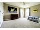 Bright bedroom with gray carpet, large windows, ceiling fan, and a fun batman theme at 6377 Harvey Dr, Plainfield, IN 46168