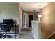 Hallway with a desk, open doors, and contemporary lighting at 6377 Harvey Dr, Plainfield, IN 46168