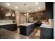 A spacious kitchen featuring wooden cabinets, stainless steel appliances, and a large island at 6377 Harvey Dr, Plainfield, IN 46168