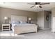 Spacious bedroom with a large bed, ceiling fan and soft carpet, perfect for relaxation at 6377 Harvey Dr, Plainfield, IN 46168