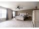 Bright bedroom with large windows, a ceiling fan, neutral walls and soft carpet at 6377 Harvey Dr, Plainfield, IN 46168