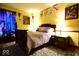 This bedroom features an eye-catching dragon themed curtain and matching shield decor at 6412 Fall Creek Rd, Indianapolis, IN 46220