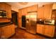 Spacious kitchen with stainless steel appliances, including a large refrigerator and double ovens, providing ample cooking space at 6412 Fall Creek Rd, Indianapolis, IN 46220