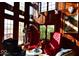 Luxurious living area with rich wood paneling, large windows, comfortable seating, and elegant decor at 6412 Fall Creek Rd, Indianapolis, IN 46220