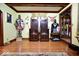 Unique room with hardwood floors, decorative chairs, armor, and shields at 6412 Fall Creek Rd, Indianapolis, IN 46220
