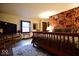 Large main bedroom suite featuring a decorative area rug and flat screen television at 6412 Fall Creek Rd, Indianapolis, IN 46220