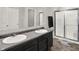 Bathroom with double sink vanity, shower, and neutral walls and finishes at 6645 Honeysuckle Way, Pendleton, IN 46064