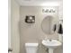 Well-lit half bathroom featuring pedestal sink and neutral color palette at 6645 Honeysuckle Way, Pendleton, IN 46064